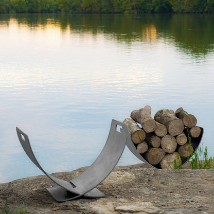 Modern stainless steel log rack with curved Wings of Flight design for stylish firewood storage